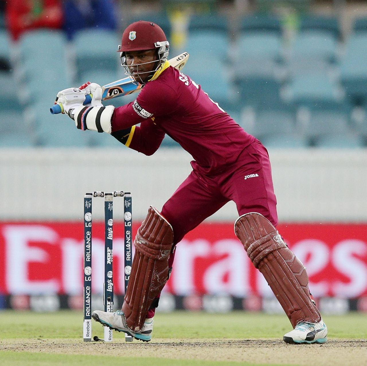 Marlon Samuels winds up for a big blow, West Indies v Zimbabwe, World Cup 2015, Group B, Canberra, February 24, 2015