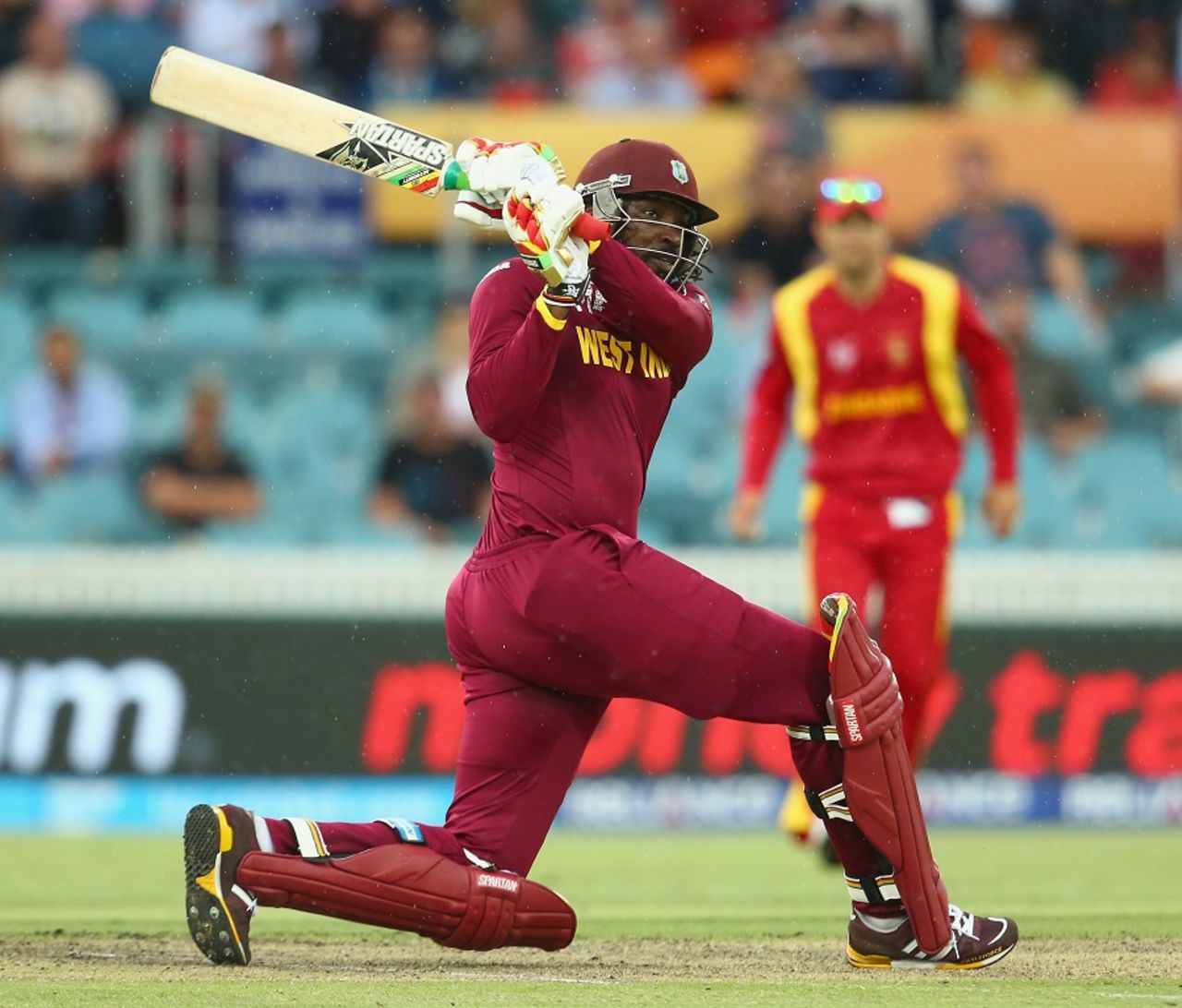 Chris Gayle unleashes a slog sweep, West Indies v Zimbabwe, World Cup 2015, Group B, Canberra, February 24, 2015