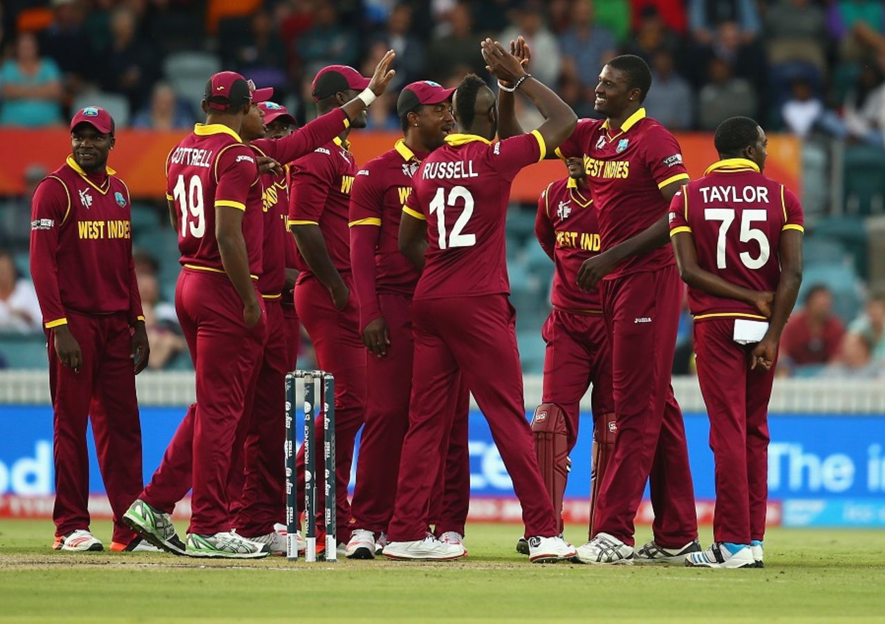West Indies get together after a successful review from Jason Holder, West Indies v Zimbabwe, World Cup 2015, Group B, Canberra, February 24, 2015