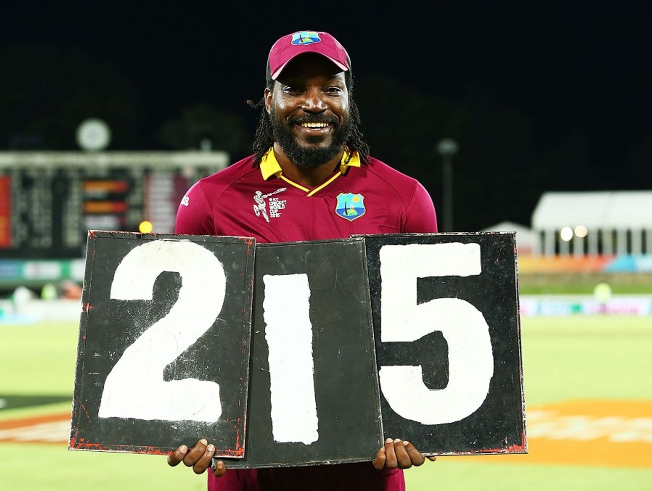 It's all mine: Chris Gayle holds the scoring plates that shout out his record, West Indies v Zimbabwe, World Cup 2015, Group B, Canberra, February 24, 2015
