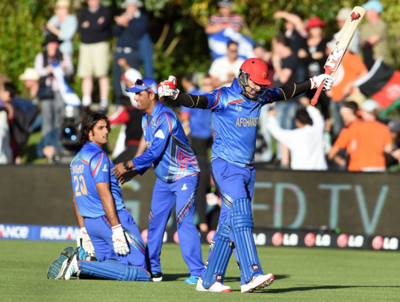 Hamid Hassan celebrates as Shapoor Zadran is down on his knees after winning,  Afghanistan v Scotland, World Cup 2015, Group A, Dunedin, February 26, 2015
