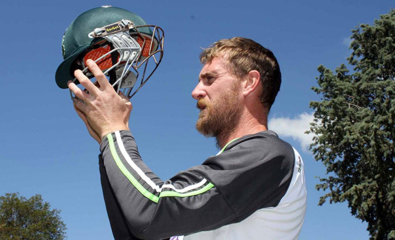 John Mooney displays the homespun neck protection on his helmet, Canberra, February 26, 2014