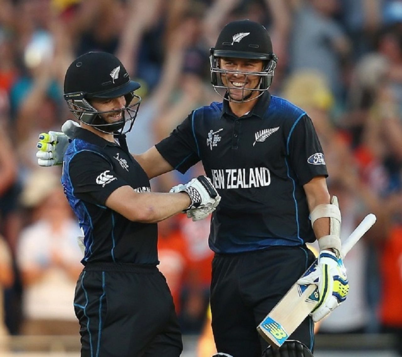 Kane Williamson is embraced by Trent Boult after sealing the nervy chase with a six, New Zealand v Australia, World Cup 2015, Group A, Auckland, February 28, 2015