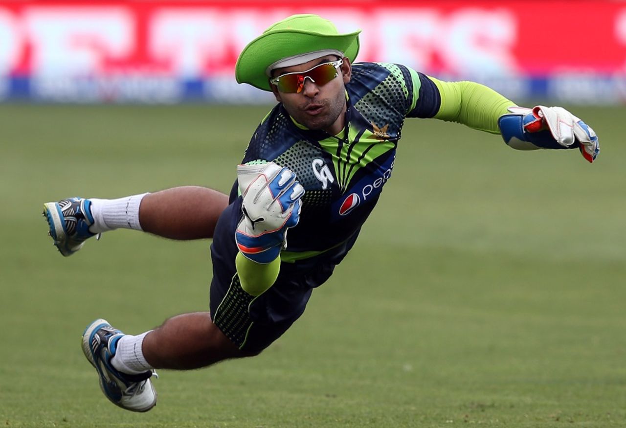 Umar Akmal dives in an attempt to catch the ball during training, Napier, March 3, 2015