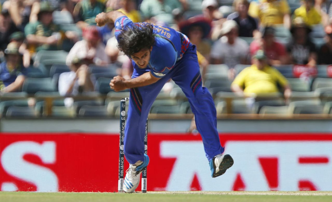 Shapoor Zadran in his follow through, Australia v Afghanistan, World Cup 2015, Group A, Perth, March 4, 2015