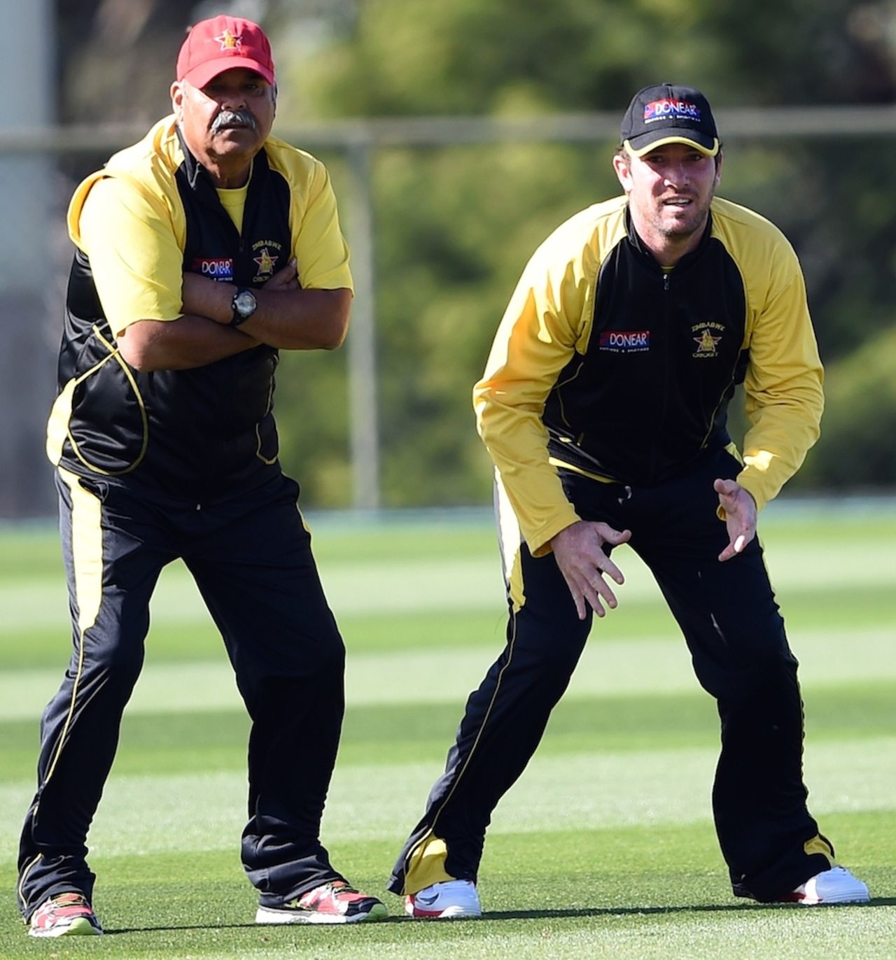 Dav Whatmore and Brendan Taylor react during a training session, World Cup 2015, Canberra, March 4, 2015