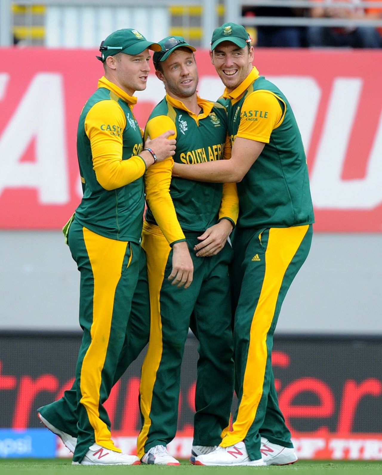AB de Villiers is flanked by David Miller and Kyle Abbott after taking a catch, Pakistan v South Africa, World Cup 2015, Group B, Auckland, March 7, 2015