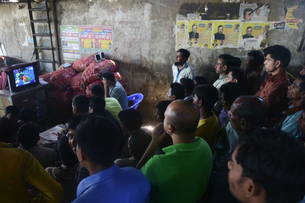  Bangladesh fans watch the game on television at a wholesale market in Dhaka, England v Bangladesh, World Cup 2015, Group A, Adelaide, March 9, 2015