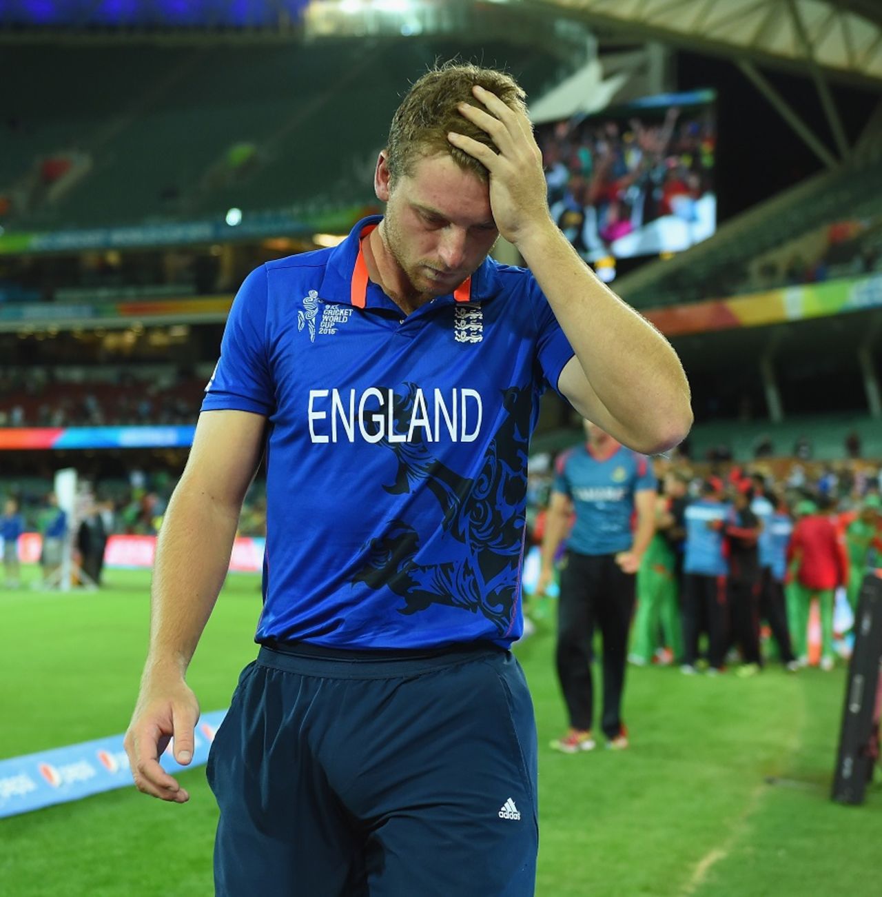 What just happened? Jos Buttler is left crestfallen after his team's elimination, England v Bangladesh, World Cup 2015, Group A, Adelaide, March 9, 2015