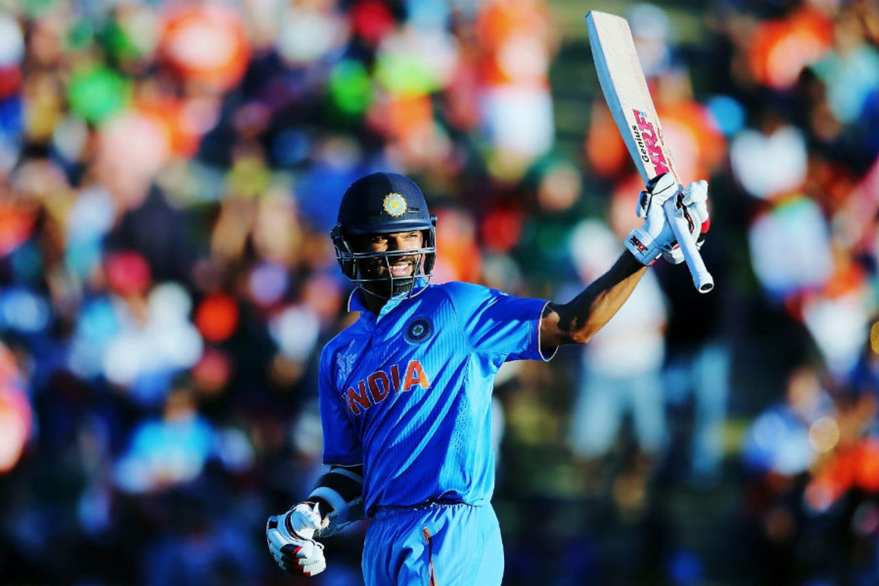 Shikhar Dhawan raises his bat after his fifty, India v Ireland, World Cup 2015, Group B, Hamilton, March 10, 2015
