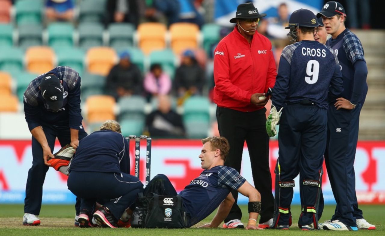 Richie Berrington is tended to after he slipped in his follow through, Scotland v Sri Lanka, World Cup 2015, Group A, Hobart, March 11, 2015