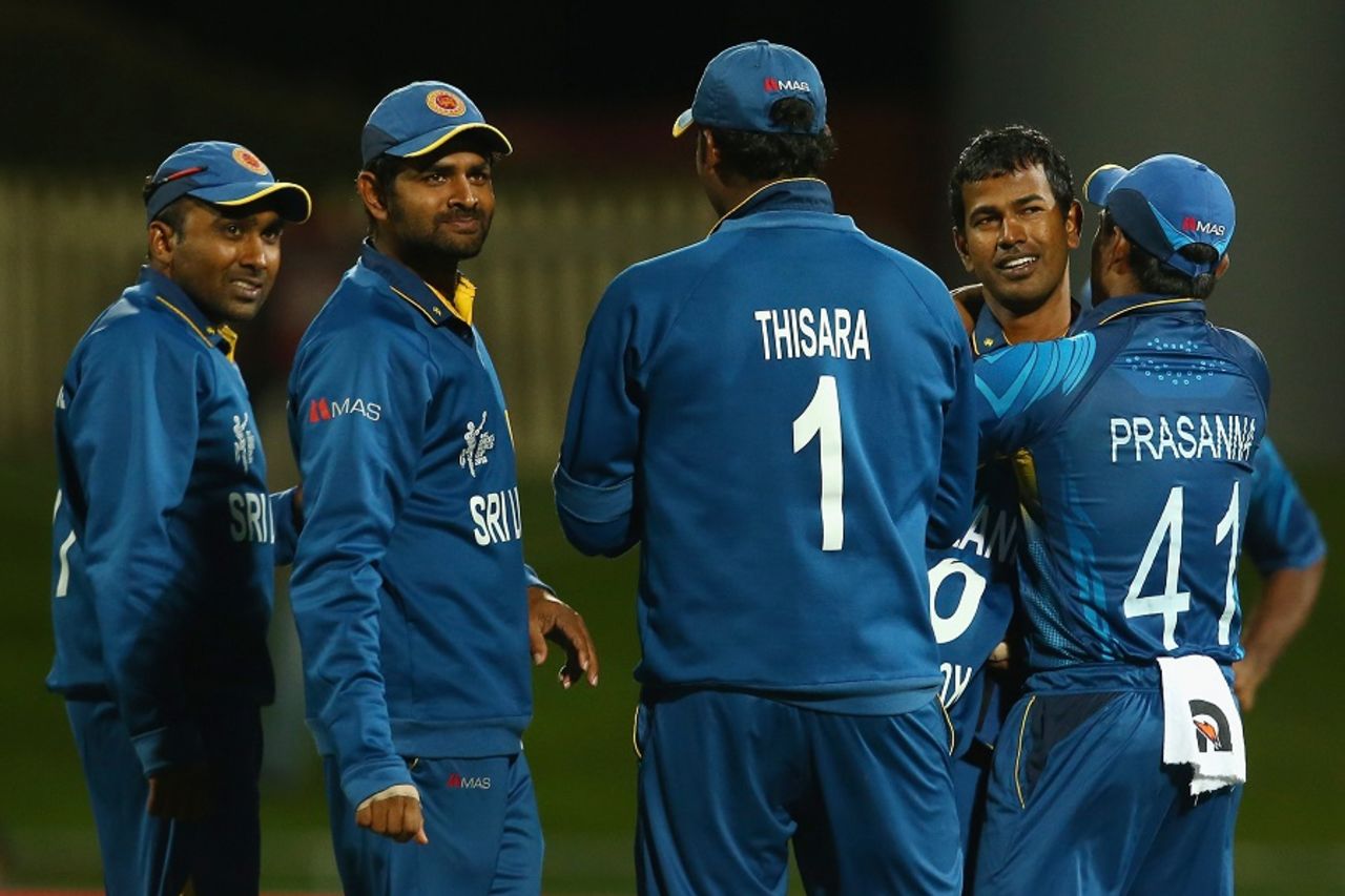 Nuwan Kulasekara is congratulated by his team-mates after dismissing Freddie Coleman, Scotland v Sri Lanka, World Cup 2015, Group A, Hobart, March 11, 2015 