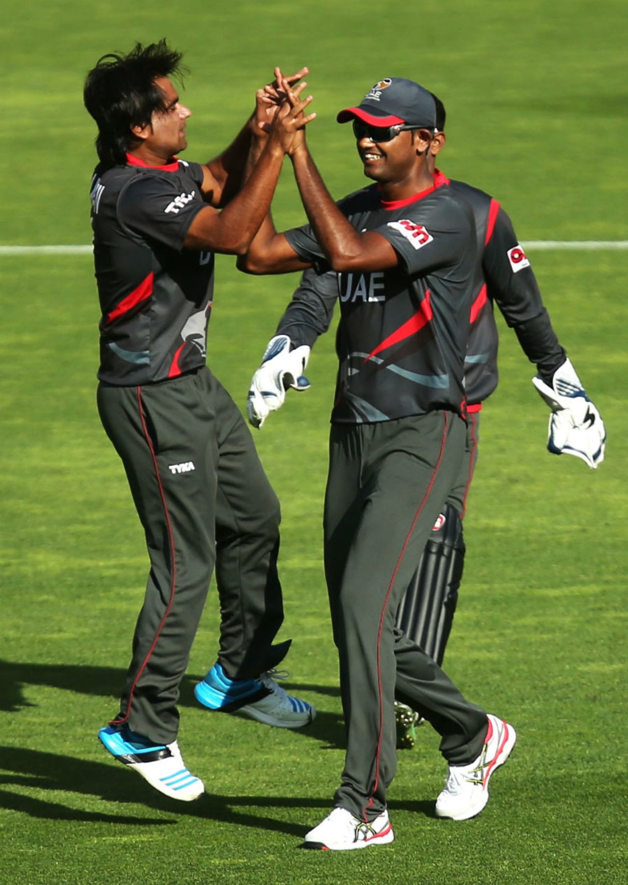 Kamran Shazad is congratulated after he dismissed AB de Villiers, South Africa v United Arab Emirates, World Cup 2015, Group B, Wellington, March 12, 2015