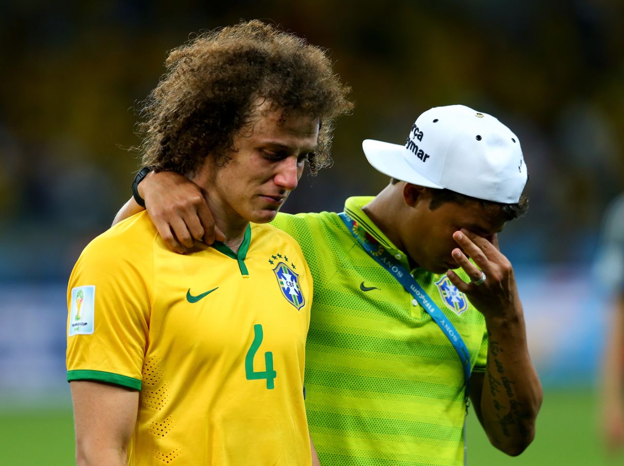 David Luiz and Thiago Silva of Brazil cry after the 1-7 defeat to Germany in the football World Cup, July 8, 2014, Brazil