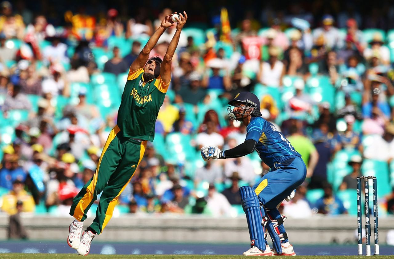 Imran Tahir takes a catch off his own bowling to dismiss Lahiru Thirimanne , South Africa v Sri Lanka, World Cup 2015, 1st quarter-final, Sydney, March 18, 2015