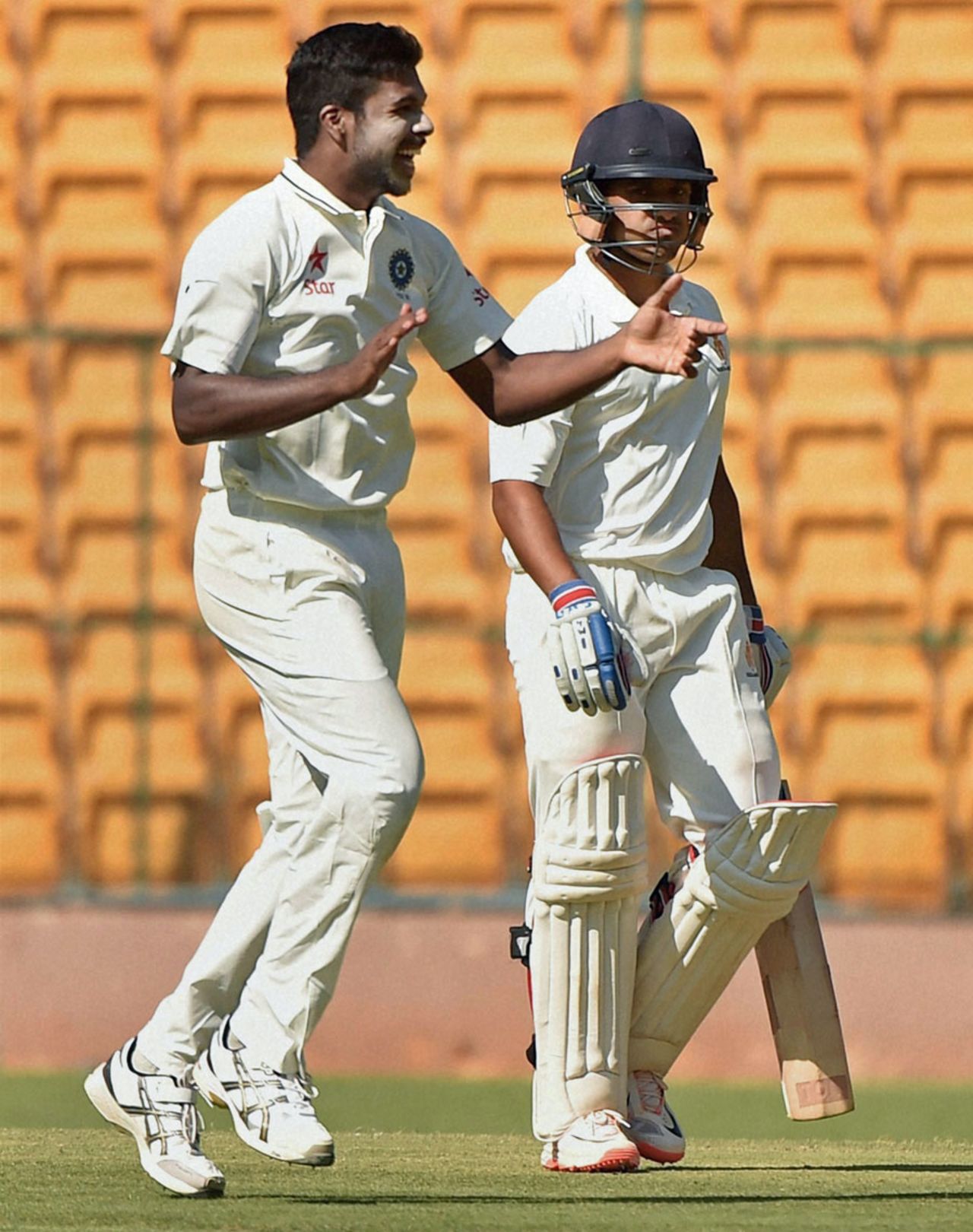 Varun Aaron celebrates after getting the wicket of Karun Nair, Karnataka v Rest of India, Irani Cup 2014-15, 1st day, Bangalore, March 17, 2015