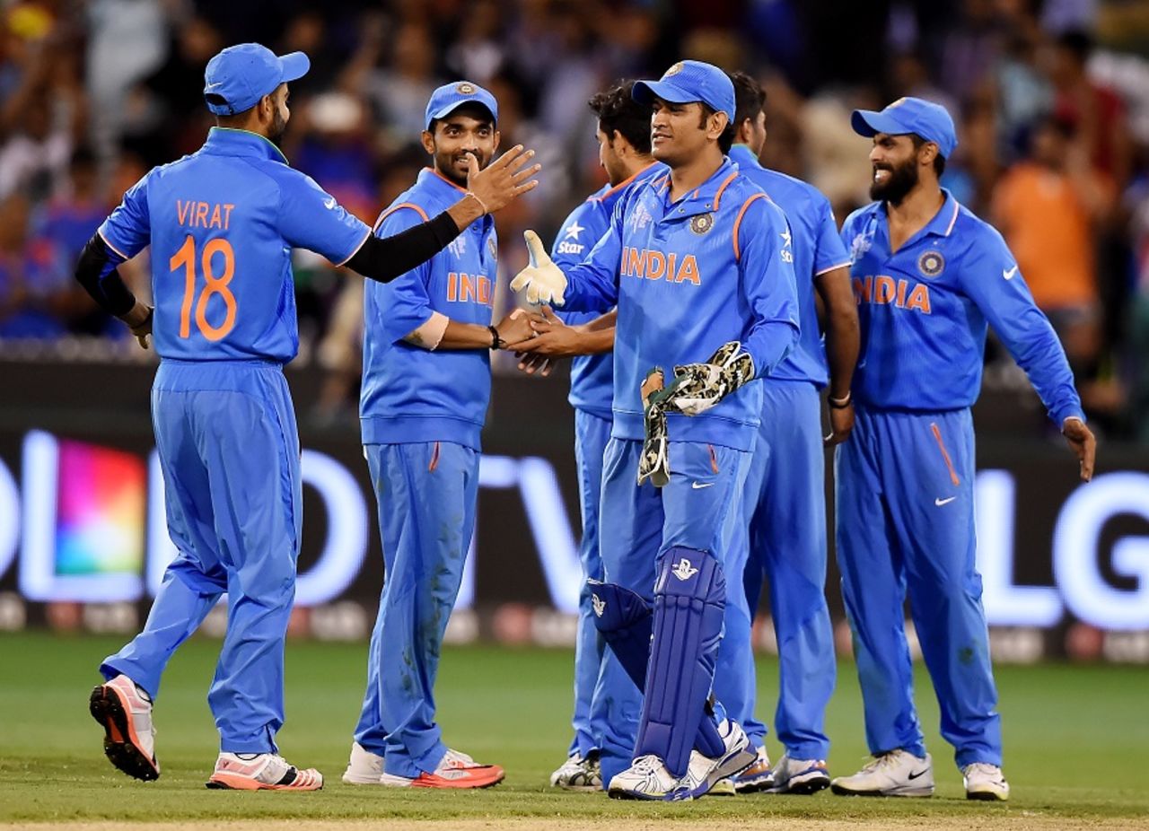 MS Dhoni congratulates his team-mates after sealing the win, Bangladesh v India, World Cup 2015, 2nd quarter-final, Melbourne, March 19, 2015
