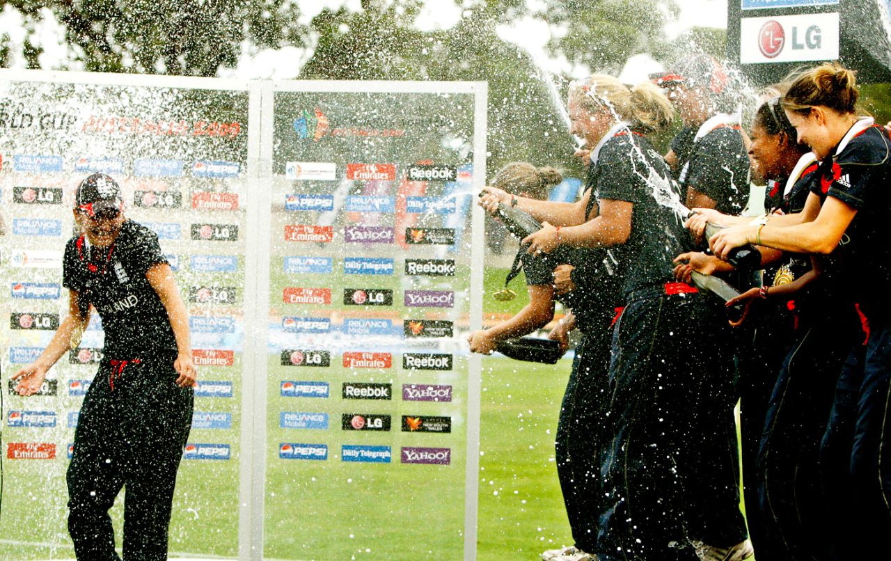 England's players spray champagne on captain Charlotte Edwards, England v New Zealand, women's World Cup final, Sydney, March 22, 2009