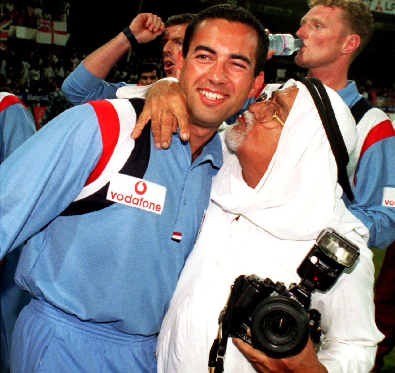 Adam Hollioake gets a kiss from a photographer after England win the trophy, England v West Indies, Akai-Singer Champions Trophy final, Sharjah, December 19, 1997