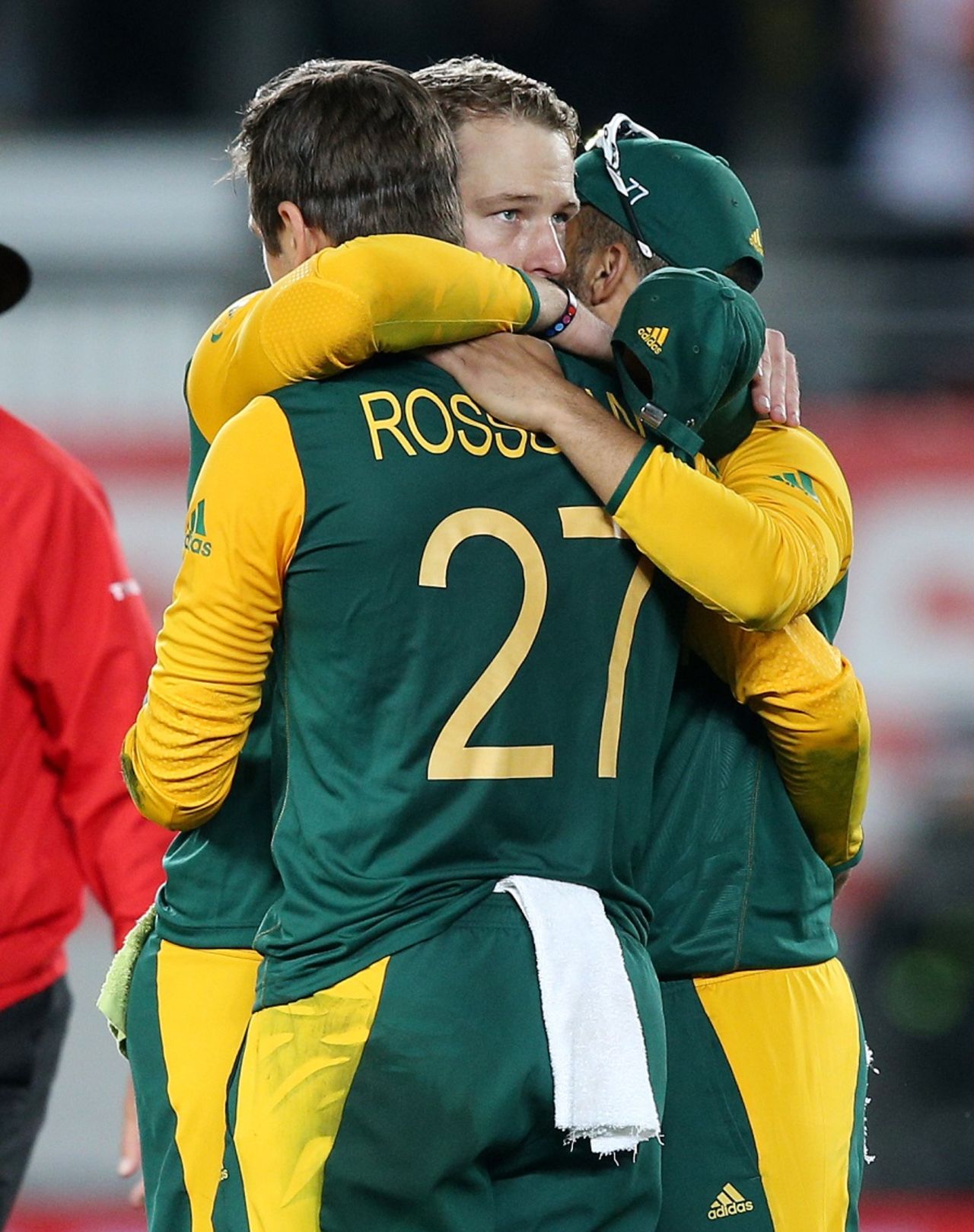 David Miller is embraced by his team-mates after coming up short, New Zealand v South Africa, World Cup 2015, 1st Semi-Final, Auckland, March 24, 2015