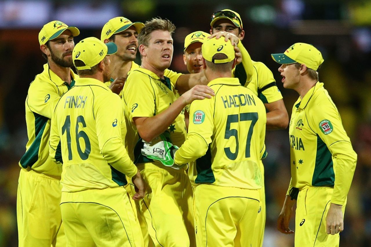 James Faulkner is mobbed after having Suresh Raina caught behind, Australia v India, World Cup 2015, 2nd semi-final, Sydney, March 26, 2015