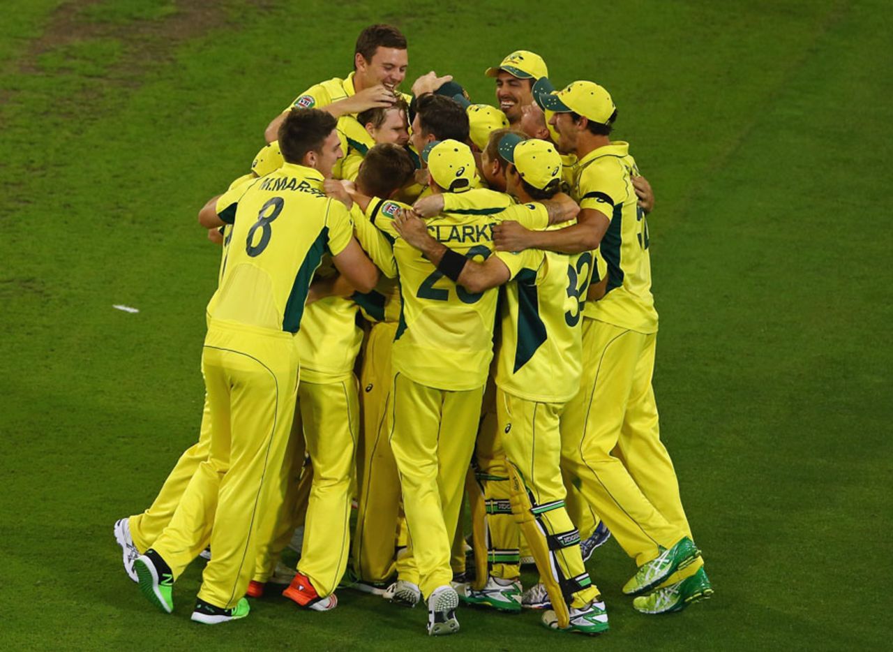 The victorious Australia side get into a huddle to celebrate their World Cup title, Australia v New Zealand, World Cup 2015, final, Melbourne, March 29, 2015