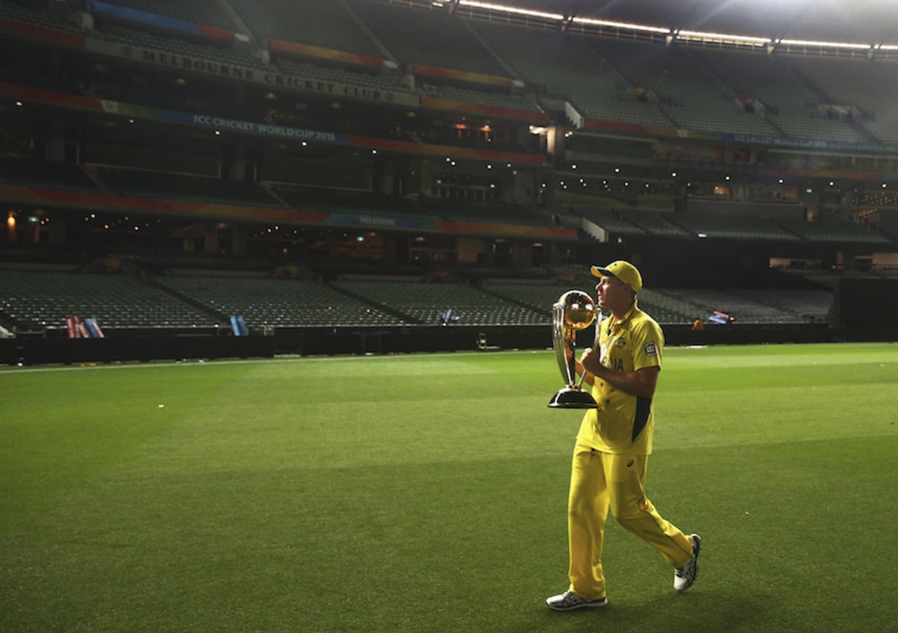 James Faulkner enjoys a solitary moment with the trophy,  Australia v New Zealand, World Cup 2015, final, Melbourne, March 29, 2015