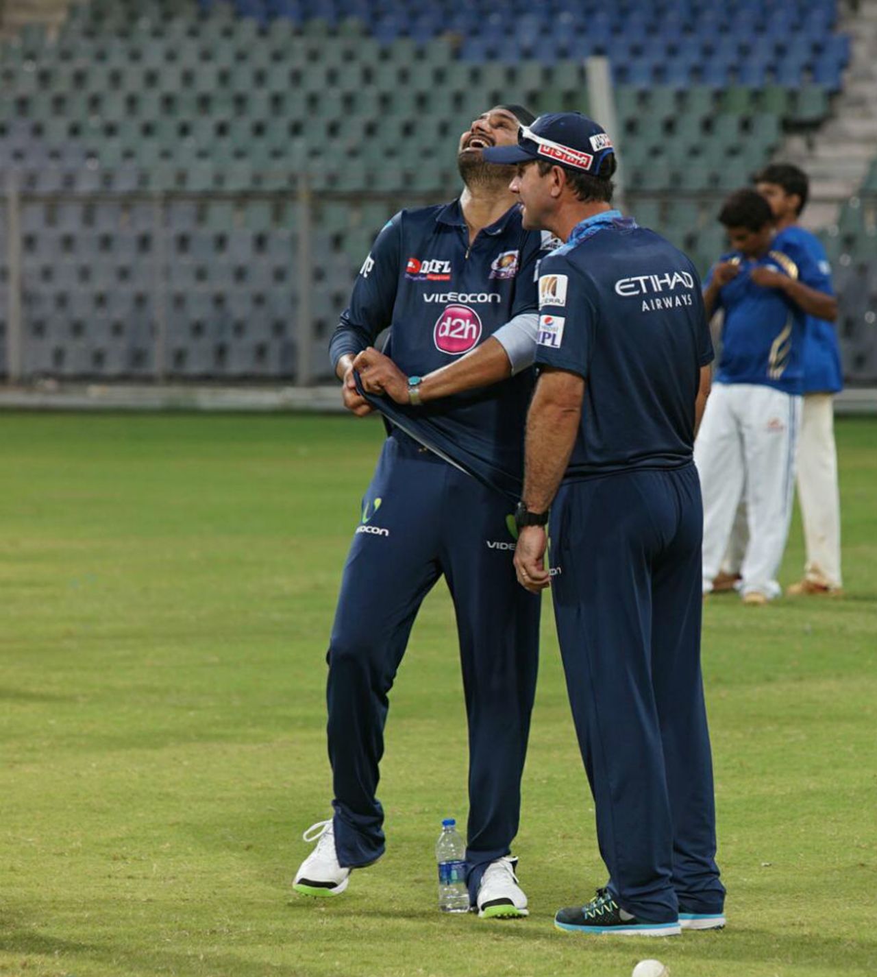 Harbhajan Singh and Ricky Ponting share a laugh at a training session, Mumbai, April 2, 2015 