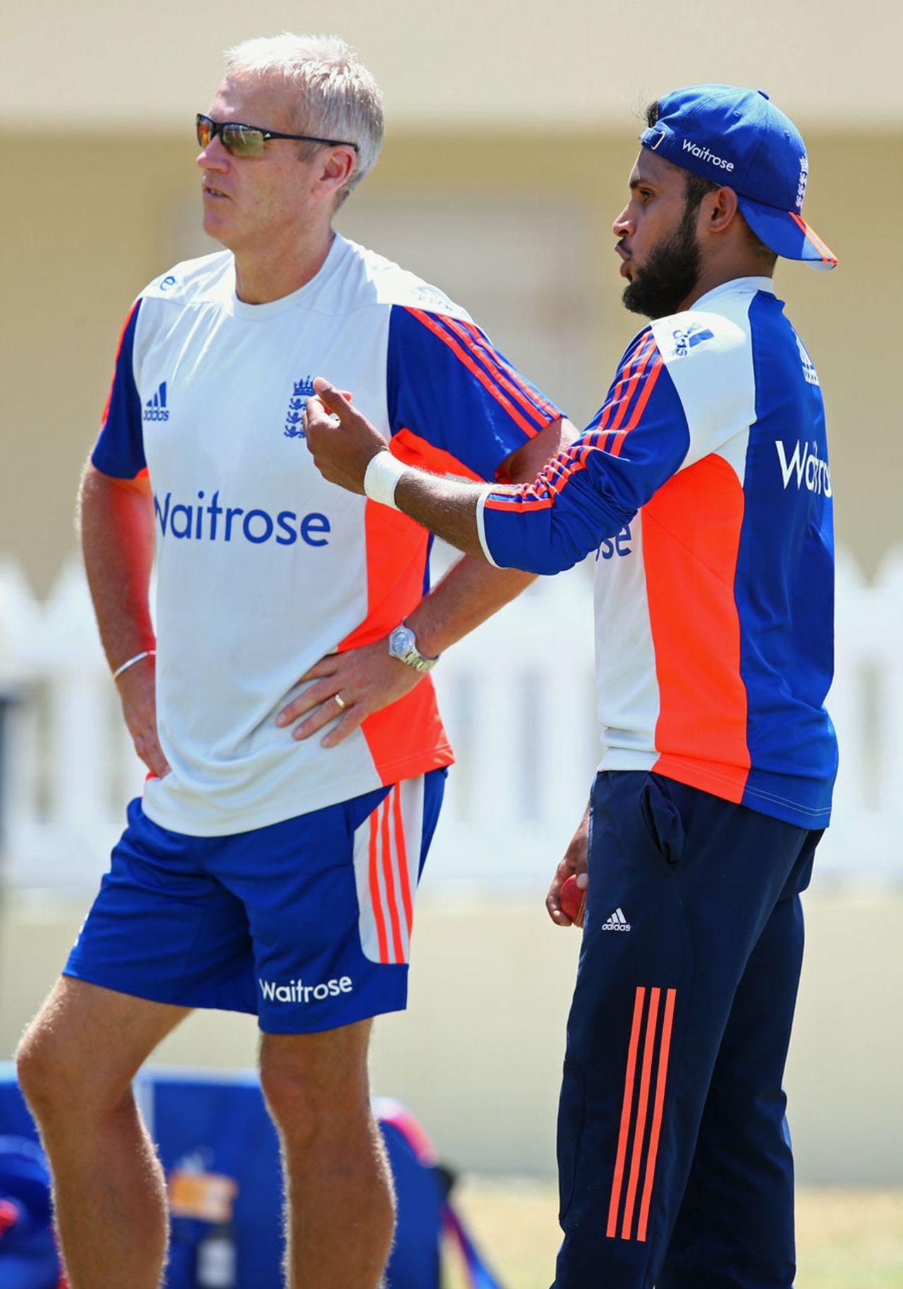Legspinner Adil Rashid talks to England coach Peter Moores during a training session, St Kitts, April 5, 2015