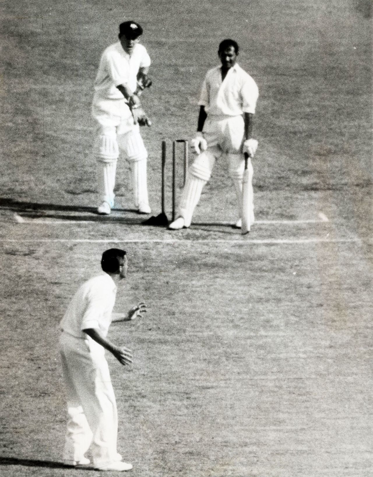 Richie Benaud and wicketkeeper Wally Grout wait for the umpire's decision after batsman Joe Solomon's cap falls and dislodges a bail, Australia v West Indies, 2nd Test, Melbourne, 3rd day, January 2, 1961