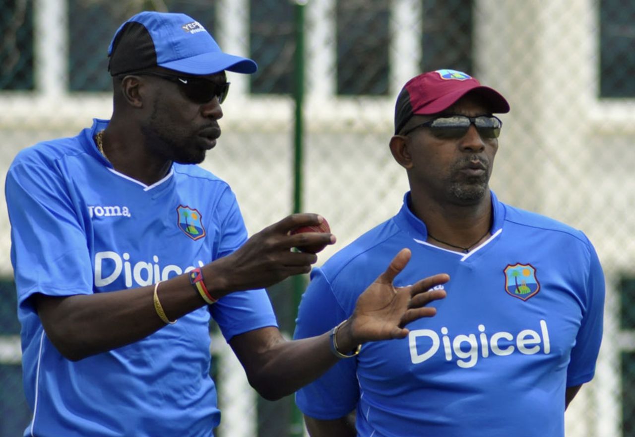 Curtly Ambrose and Phil Simmons watch over a training session, Antigua, April 6, 2015