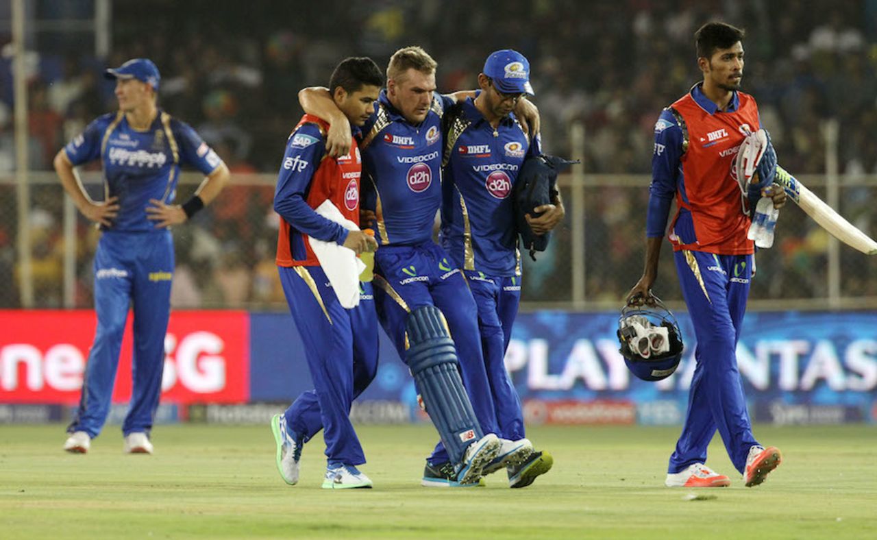 Aaron Finch is helped off the field after an injury, Rajasthan Royals v Mumbai Indians, IPL 2015, Ahmedabad, April 14, 2015