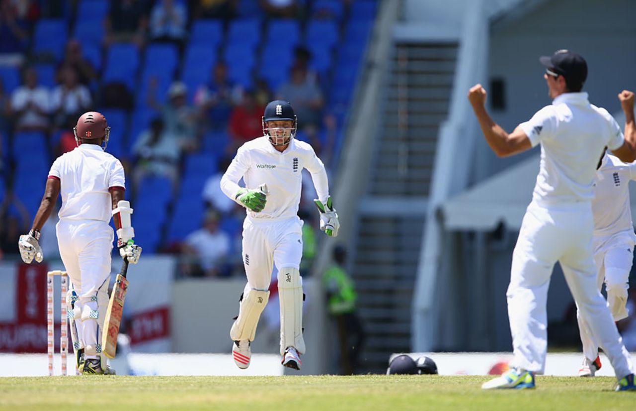Alastair Cook celebrates as Shivnarine Chanderpaul drives to cover, West Indies v England, 1st Test, North Sound, 3rd day, April 15, 2015