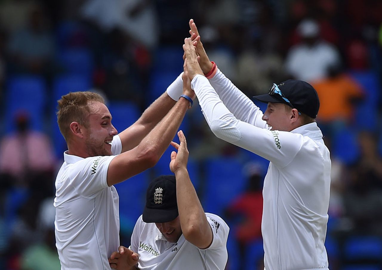 The high five: James Tredwell goes underneath the celebration of Stuart Broad and Joe Root, West Indies v England, 1st Test, North Sound, 3rd day, April 15, 2015