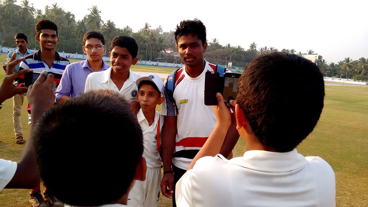 Young fans get their pictures taken with Sanju Samson, Tellicherry, February 2015