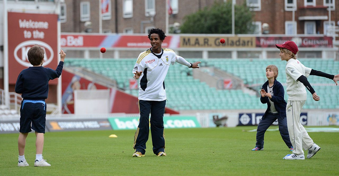 Thami Tsolekile with local school children during a coaching clinic in aid of Nelson Mandela Day, The Oval, London, July 18, 2012
