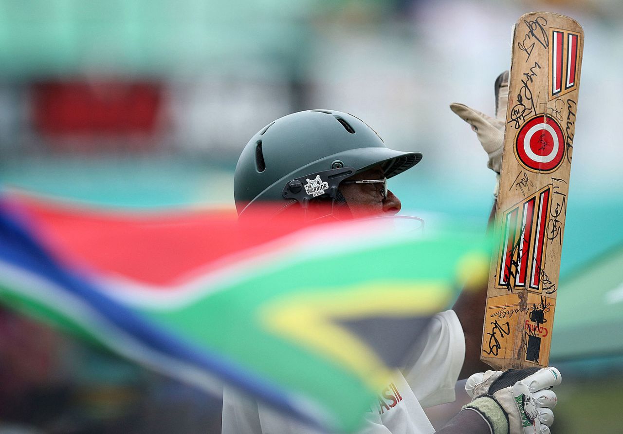 The South Africa flag waves as a fan looks on, South Africa v India, 2nd Test, Durban, 4th day, December 29, 2013