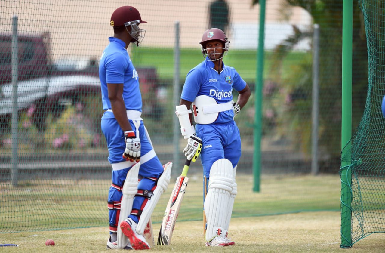 Marlon Samuels and Shivnarine Chanderpaul wait to bat, Grenada, April 20, 2015