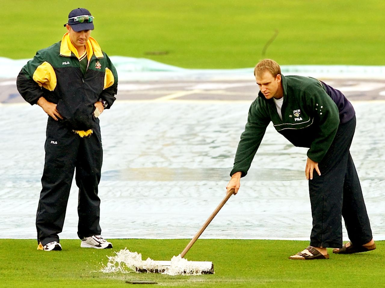 Justin Langer watches as Matthew Hayden sweeps the water away, England v Australia, 4th Test, Headingley, 1st day, August 16, 2001