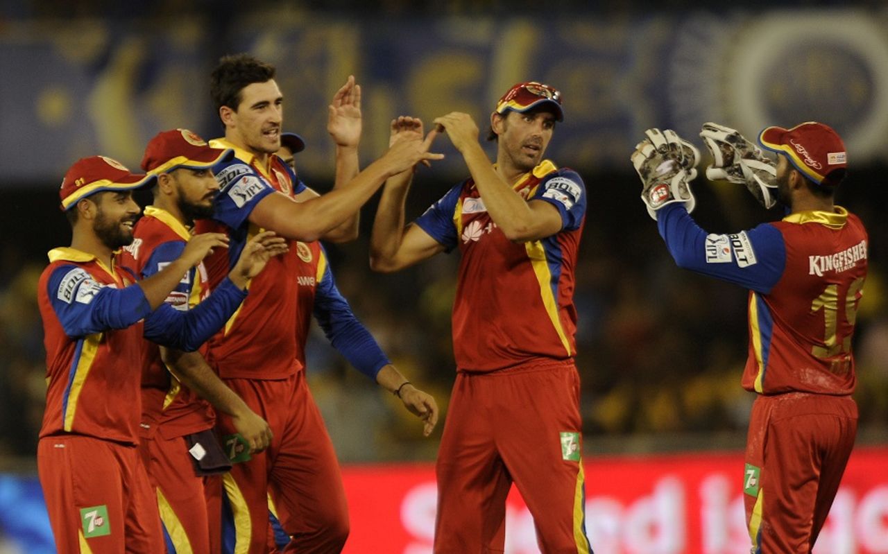 Mitchell Starc is mobbed by his team-mates, Rajasthan Royals v Royal Challengers Bangalore, IPL 2015, Ahmedabad, April 24, 2015