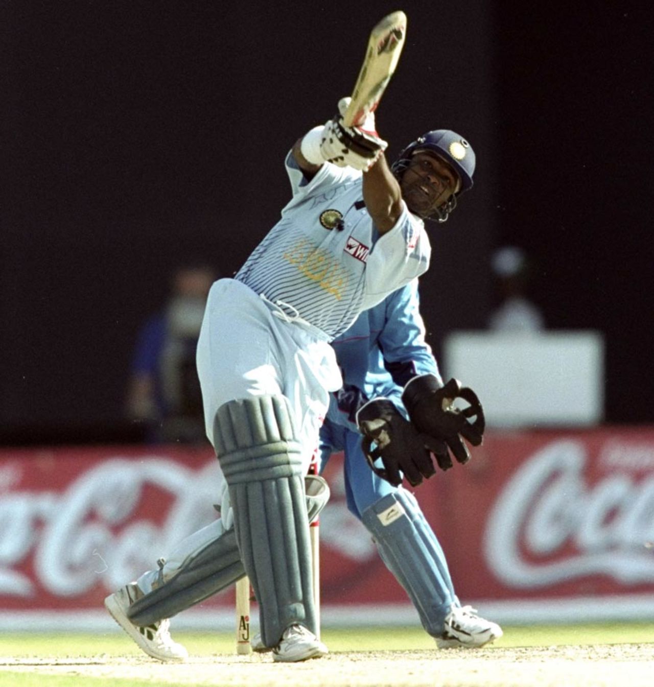 Vinod Kambli launches the ball back over the bowler, England v India, Coca Cola Cup, Sharjah, April 11, 1999 