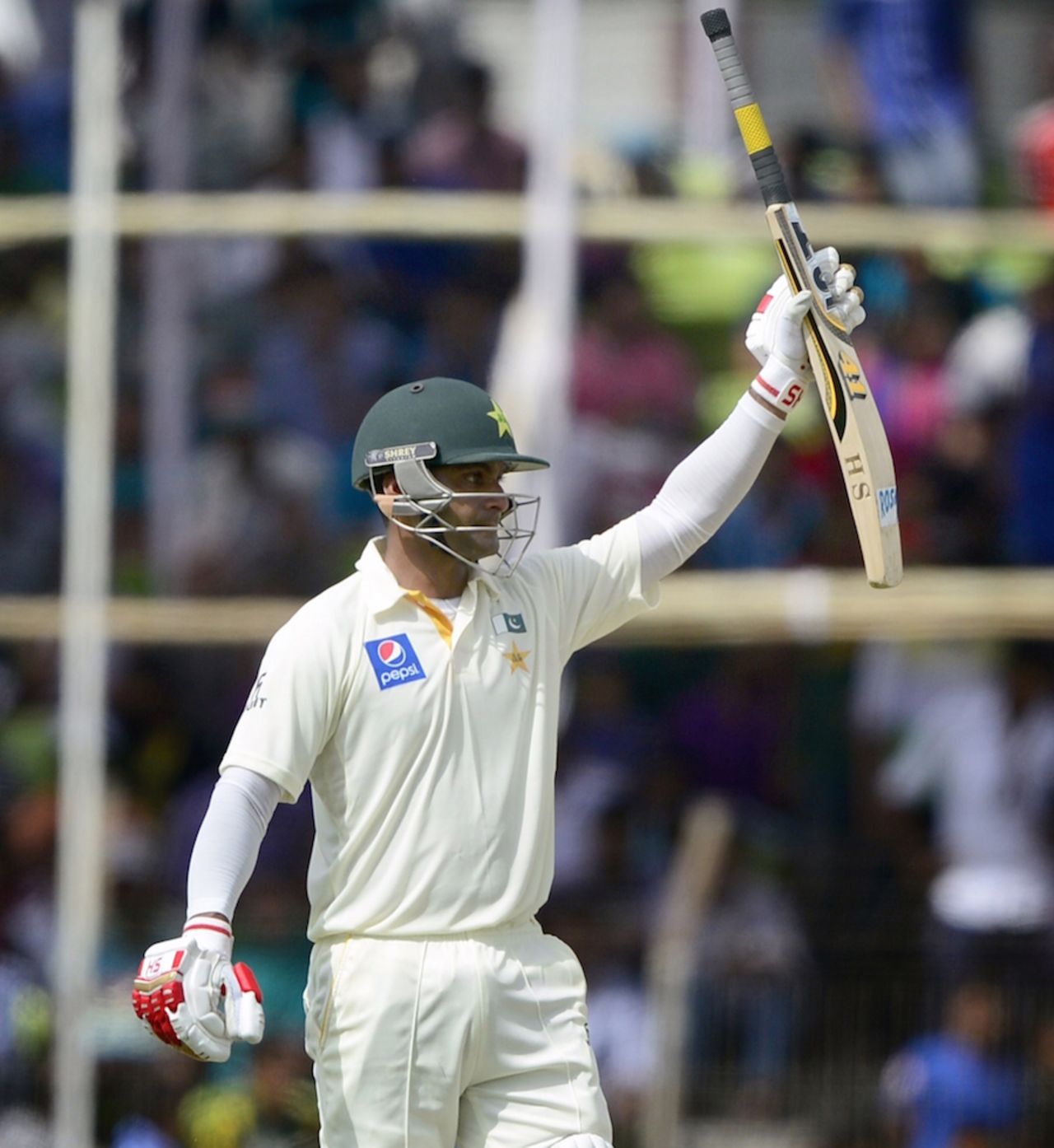 Mohammad Hafeez raises his bat after reaching his half-century, Bangladesh v Pakistan, 1st Test, Khulna, 2nd day, April 29, 2015