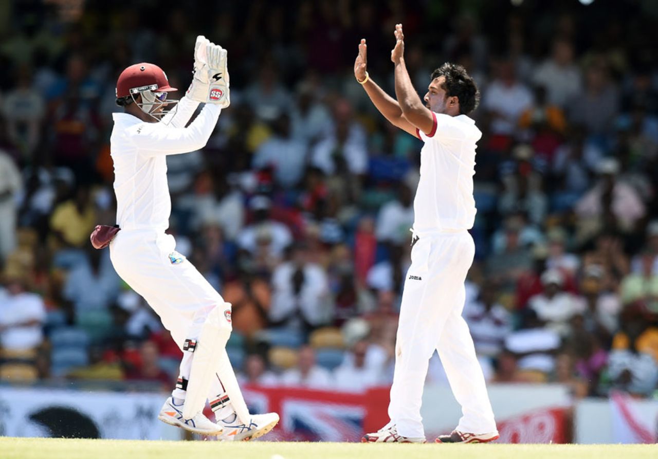 Denesh Ramdin has a high five for Veerasammy Permaul, West Indies v England, 3rd Test, Bridgetown, 1st day, May 1, 2015
