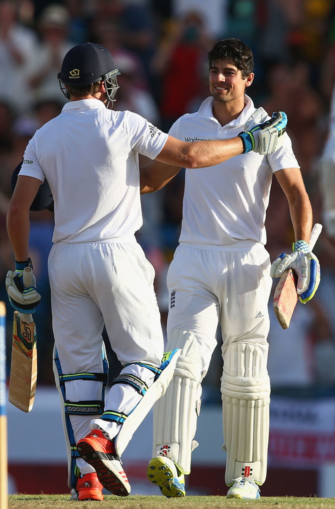 Alastair Cook gets a hug from Jos Buttler, West Indies v England, 3rd Test, Bridgetown, 1st day, May 1, 2015