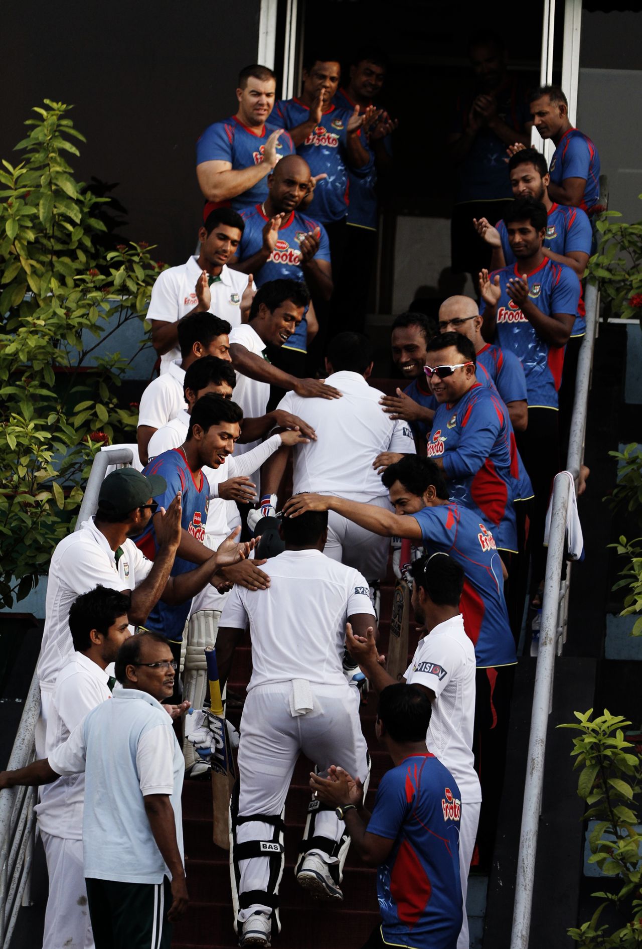 The Bangladesh players welcome back Tamim Iqbal and Imrul Kayes after their record stand, Bangladesh v Pakistan, 1st Test, Khulna, 4th day, May 1, 2015
