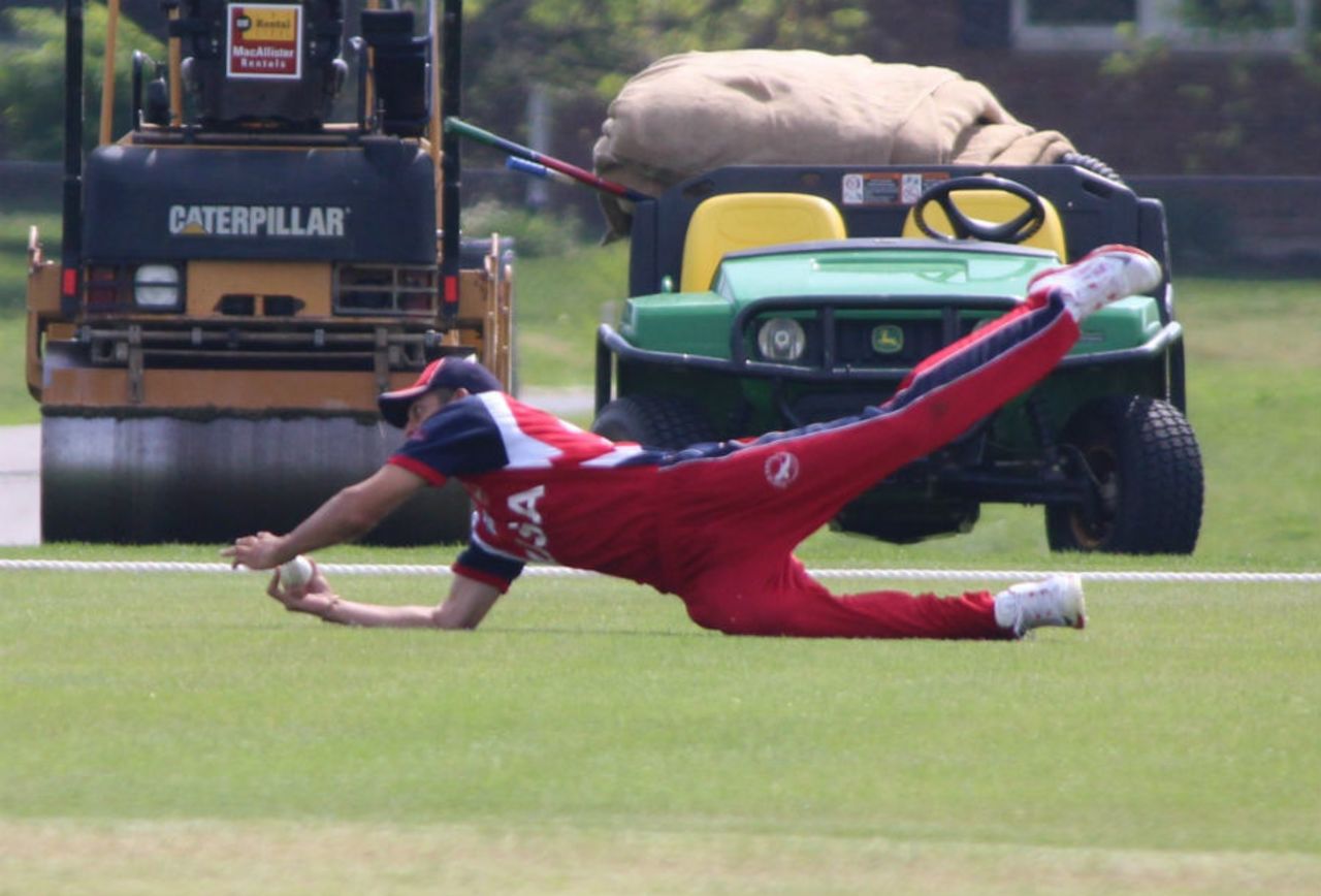 Hammad Shahid takes a diving catch at deep square leg, United States of America v Suriname, ICC Americas Region Division One Twenty20, May 8, 2015