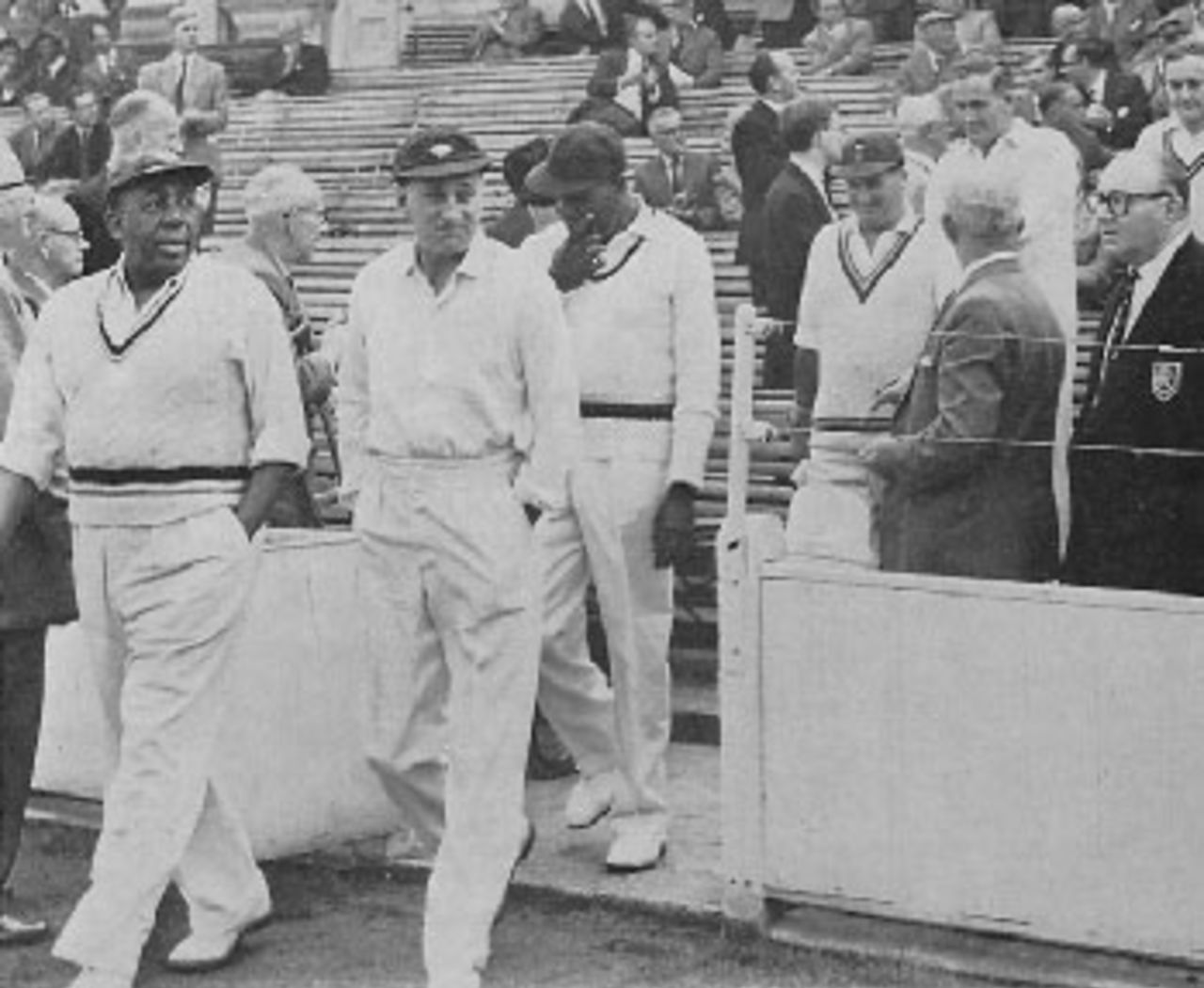 Sir Learie Constantine leads out his team to meet the West Indian Tourists in their final match at The Oval on Saturday, September 14, 1963. Behind Sir Learie is Sir Leonard Hutton. A crowd of 6,000 watched the game, in aid of the fund for the Anglo-Caribbean Social Centre, which the Tourists won by 62 runs. West Indies totalled 337 and Sir Learie Constantine's Twelve replied with 275