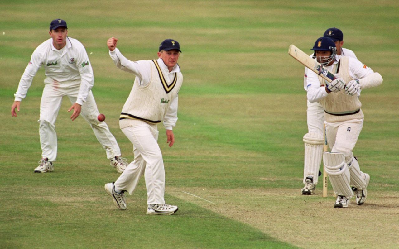 Phillip DeFreitas hits past Derek Kenway, as wicketkeeper Adrian Aymes looks on, Derbyshire v Hampshire, County Championship, Derby, September 18, 1999