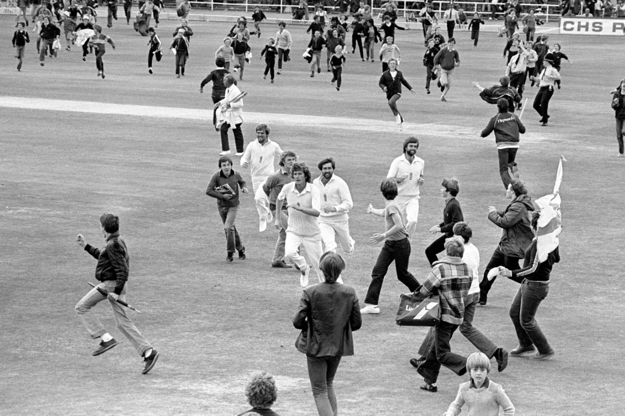 Mike Gatting, Bob Willis, Graham Gooch and Peter Willey run off the field as the fans invade after England's win, day five, England v Australia, third Test, Headingley, 21 July 1981