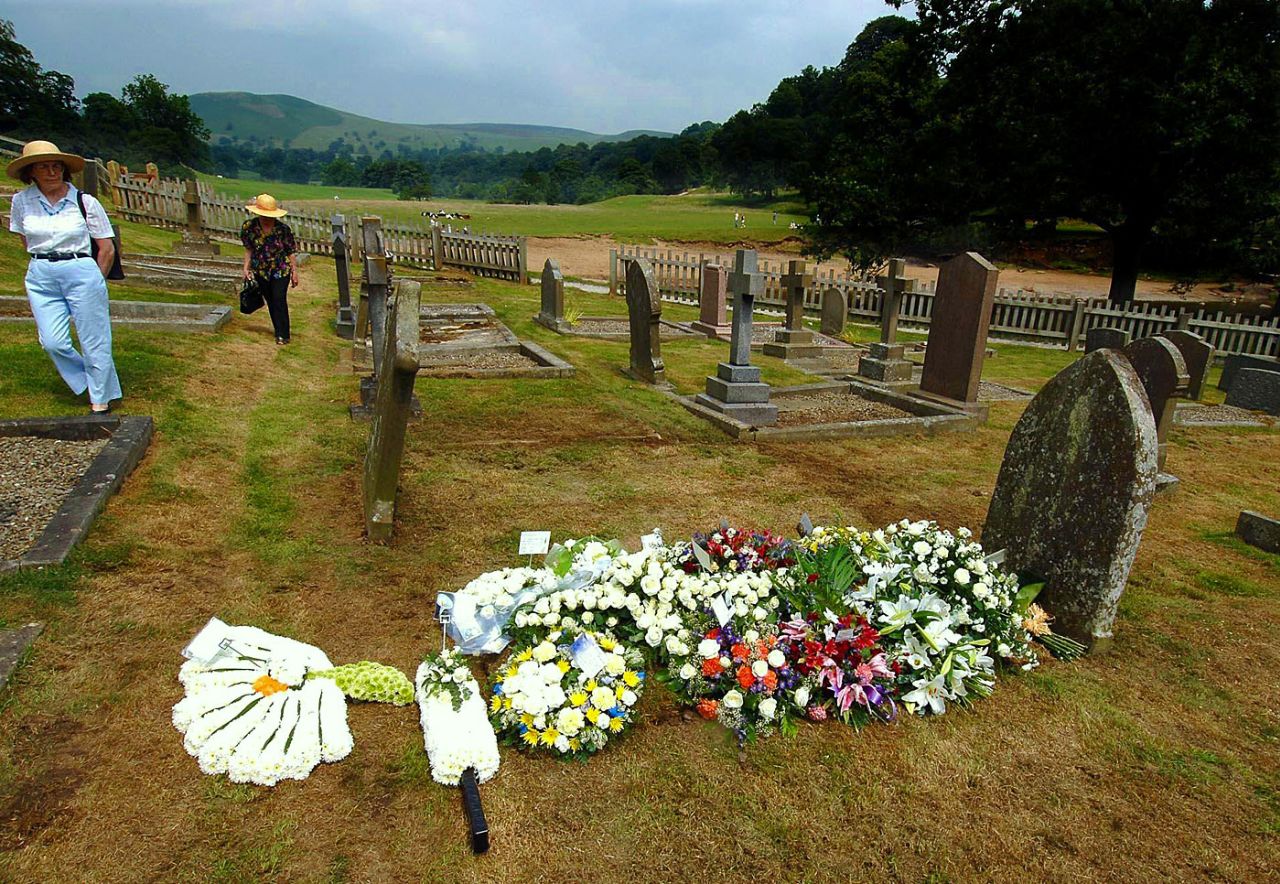 Flowers are placed on the grave of Fred Trueman at Bolton Abbey, England, July 6, 2006